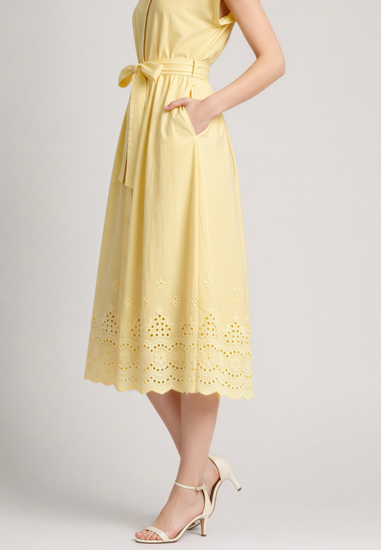 Close-up of Love Knot Hazel dress — embroidered eyelet and scalloped hem detail