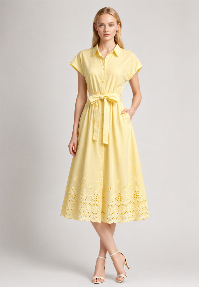 Woman wearing Love Knot Hazel yellow cotton eyelet shirt dress, front view with tie waist sash