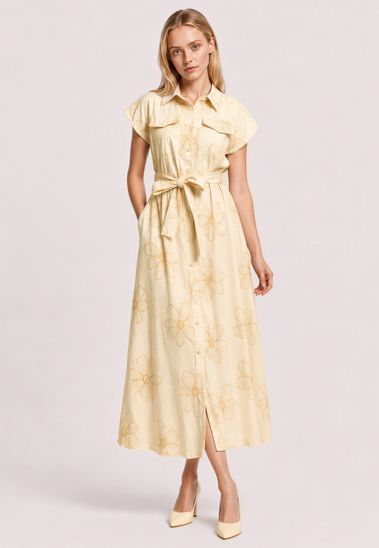 Woman wearing Love Knot Nora beige floral embroidered shirt dress, front view with tie waist sash