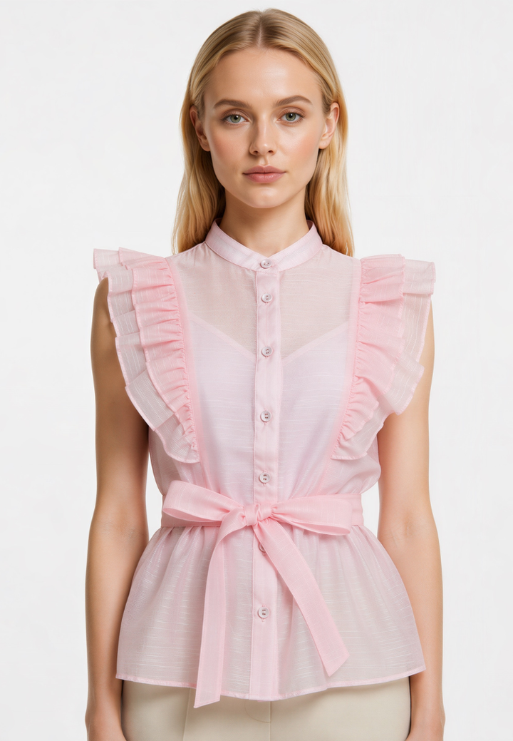 Woman wearing Love Knot Poppy pink blouse with the tie waist sash fastened in a bow