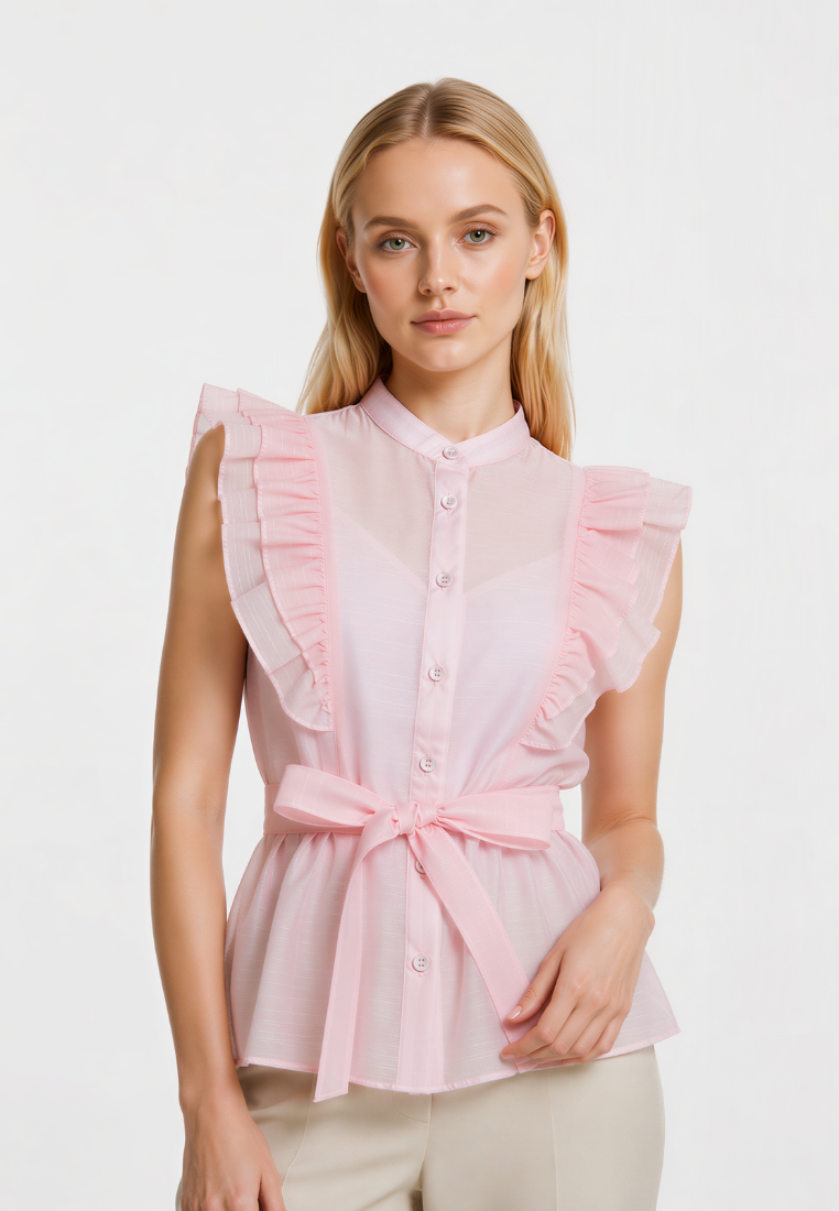 Woman wearing Love Knot Poppy pink ruffle shoulder blouse, front view with button-down front and tie waist sash