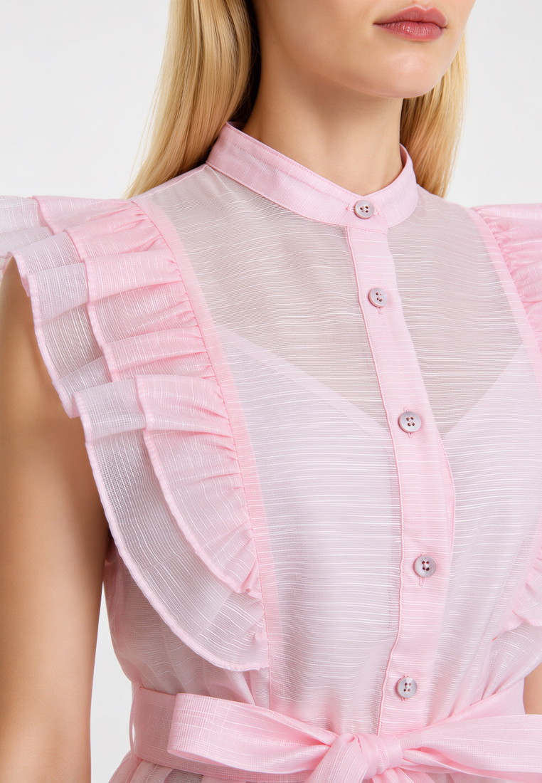 Close-up of Love Knot Poppy blouse in pink — layered ruffle shoulder and sheer fabric detail